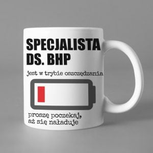 Na obrazku przedstawiony jest biały ceramiczny kubek z nadrukiem i napisem - Kubki BHP Proresult