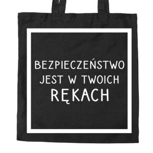Na obrazku przedstawiona jest czarna torba z białym napisem "Bezpieczeństwo jest w twoich rękach" - Bezpieczny dzień BHP Proresult