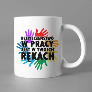 Na obrazku przedstawiony jest kubek z napisem "Bezpieczeństwo w pracy jest w twoich rękach" - Kubek BHP Proresult